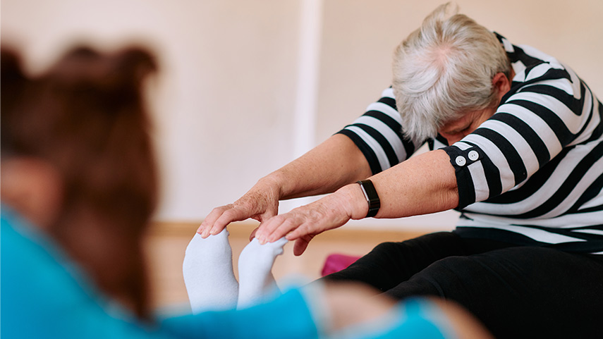 Senior woman practicing pilates at Corpus Studios