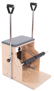 Wooden Pilates chair with a padded seat, two adjustable metal bars with handles, and a foot pedal.